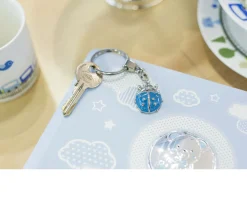 Bomboniera battesimo portachiavi coccinella azzurra con sacchetto portaconfetti Selezione zanolli