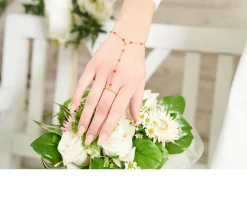 Bracciale baciamano argento rosè con anello e corallo rosso Selezione zanolli