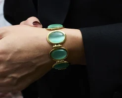 Bracciale ottone finitura oro con occhio di gatto verde acqua Sovrani