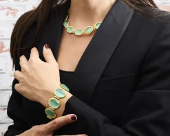 Bracciale ottone finitura oro con occhio di gatto verde acqua Sovrani