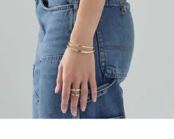 Bracciale rigido line in bronzo dorato Unoaerre