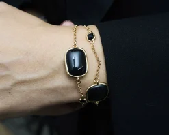 Bracciale yvette ottone finitura oro con cristalli neri e occhio di gatto nero Sovrani